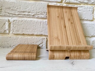 Phone and tablet stands made of wood.
