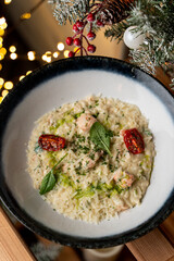 Italian risotto in new year festive surrounding, top view, side view, magazine photography