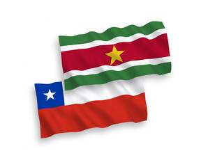 Flags of Republic of Suriname and Chile on a white background