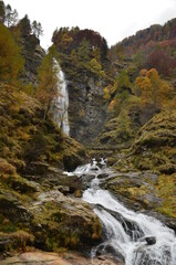 Fototapeta na wymiar Huge Waterfall at Ticino Valle Maggia, Maggiatal, Switzerland in the mountains, long exposure picture