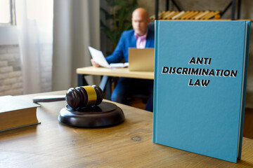  ANTI DISCRIMINATION LAW book in the hands of a jurist. Anti-discrimination law contains a number...