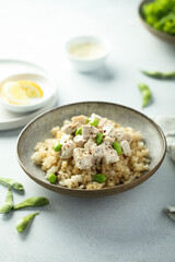 Healthy quinoa bowl with chicken and edamame beans
