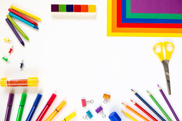 White background with school stationery. Space for text. Concept of children's creativity, back to school.