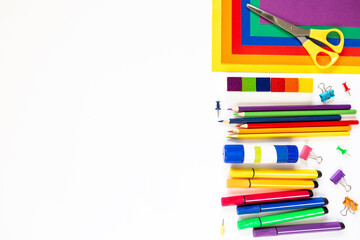 White background with school stationery. Space for text. Concept of children's creativity, back to school.