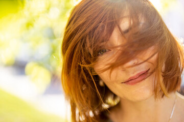 Portrait of a beautiful happy woman outdoors
