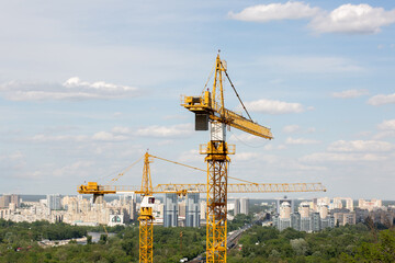 Construction tower cranes at the building site