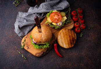 Burger and cheeseburger with tomato