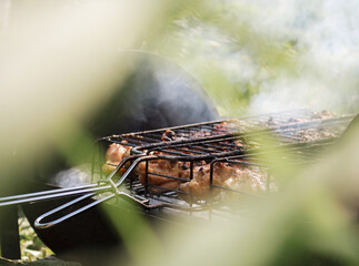 Shish kebab on a grid. Grilled meat. Homemade barbecue