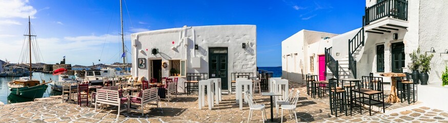 Greece travel. Cyclades, Paros island. Charming fishing village Naoussa. view of port with street bars and restaurants by the sea.