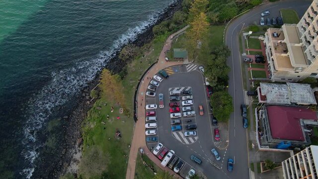 Cars At The Parking Lot Next To Goodwin Terrace And Ocean View Lookout Track. Burleigh Heads, Queensland, Australia. aerial top-down