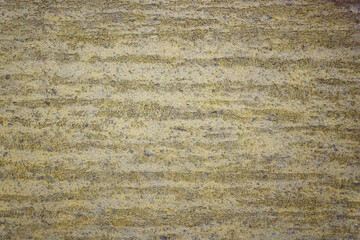 Yellow texture of old weathered golden plaster