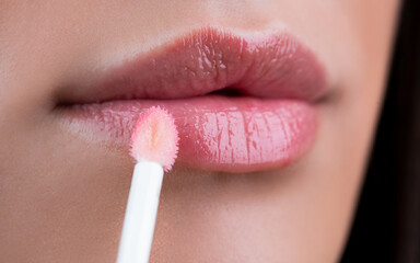 Glossy lips. Lipstick. Sexy mouth and lips close up. Puffy lips. Pink lips with lipstick. Pink...
