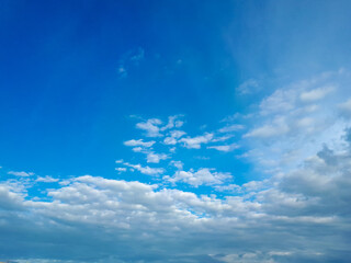 blue sky with white clouds on a sunny day background with copy space. heaven with sunlight