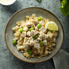 Healthy quinoa bowl with chicken and edamame beans