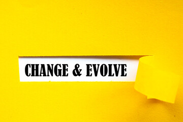 CHANGE EVOLVE. text on white paper over torn paper background. - obrazy, fototapety, plakaty