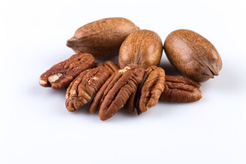 Few pecan nuts isolated on white