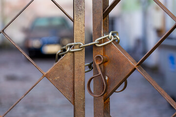 Old metal lock on chain
