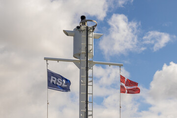 on a ferry there are two different flags, one is the romo flag and the other is the danish flag....