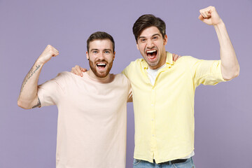 Two overjoyed excited happy cool young men friends together in casual t-shirt tattoo translate fun...