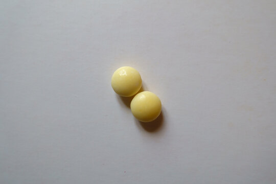 2 Round Yellow Pills Of Xylitol From Above