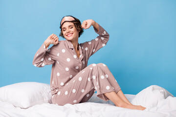 Full length photo of young cheerful girl happy positive smile sit bed awake morning isolated over...
