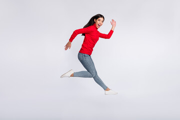 Fototapeta na wymiar Full size profile side photo of happy excited good mood asian girl running fast in air isolated on grey color background