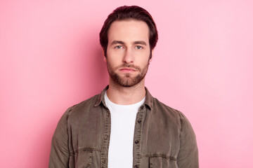 Photo of young handsome confident guy serious concentrated focused smart isolated over pink color background