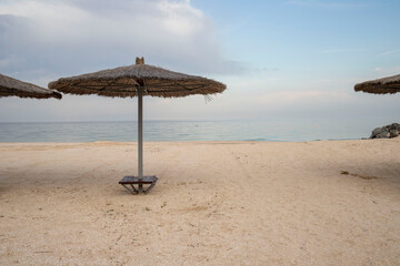 coast with an umbrella at sunrise