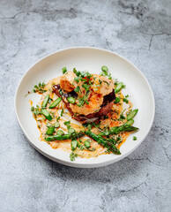 Тop sirloin steak, asparagus, shrimp and shrimp sauce with butter and garlic