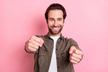 Photo of sweet funny young guy dressed brown shirt smiling imaging car driving isolated pink color background