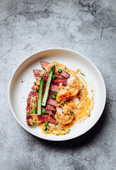 Тop sirloin steak, asparagus, shrimp and shrimp sauce with butter and garlic