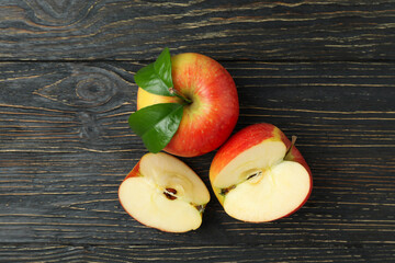 Tasty ripe red apples on wooden table