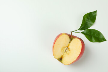 Ripe apple with leaves on white background
