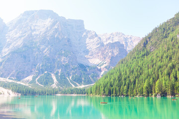  Lago di Braies is located in Braies Valley . Alps lake and coniferous forest . Boats on the  Pragser Wildsee 