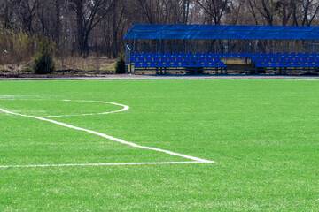 football field with gates in the park in spring