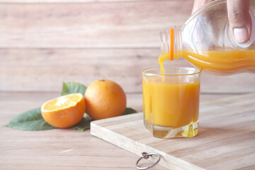  fresh orange and orange juice on table with copy space 