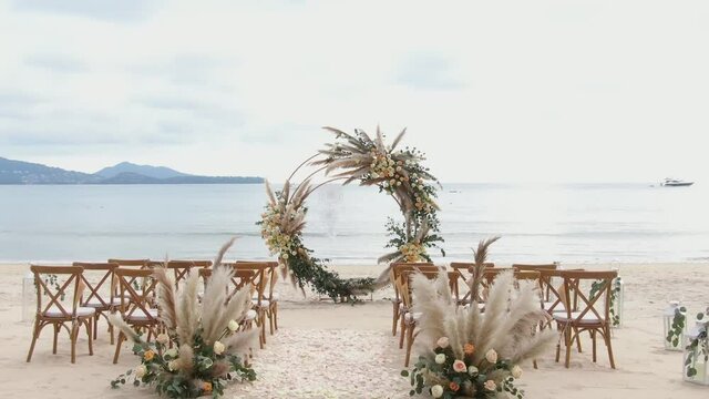 Wedding decor on the beach luxury outdoor setting and cloudy sunny. No people.	