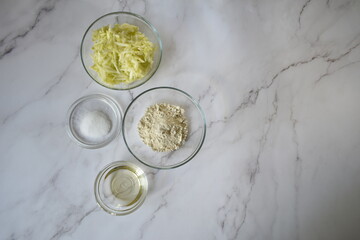 ingredients for making zucchini pancakes with copy spaces