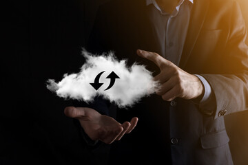 Cloud technology. Polygonal wireframe cloud storage sign with two arrows up and down on dark ....