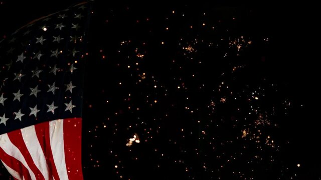 Close up of Waving American Flag with Fireworks. Super Slow Motion at 1000 fps.