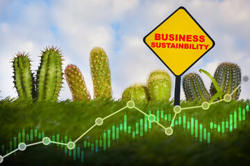 Economic growth with environment concept and sustainable future ahead idea. Business sustainability written on road sign and growth graph with cactus plant on green grasses background