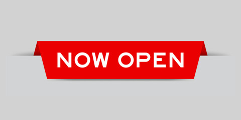 Red color inserted label with word now open on gray background