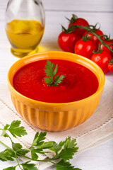 Delicious homemade tomato soup in bowl.
