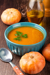 Delicious homemade pumpkin soup in bowl.