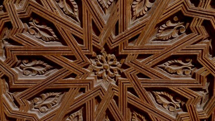 Detailed closeup of a Moroccan, wooden door with traditional wood carvings. Moroccan islamic, moorish architecture design.