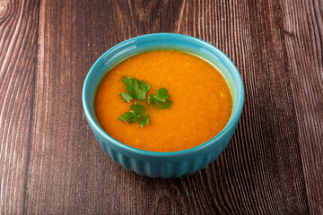 Delicious homemade pumpkin soup in bowl.