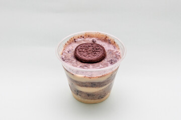 biscuit candy with chocolate in a cup on blue background.