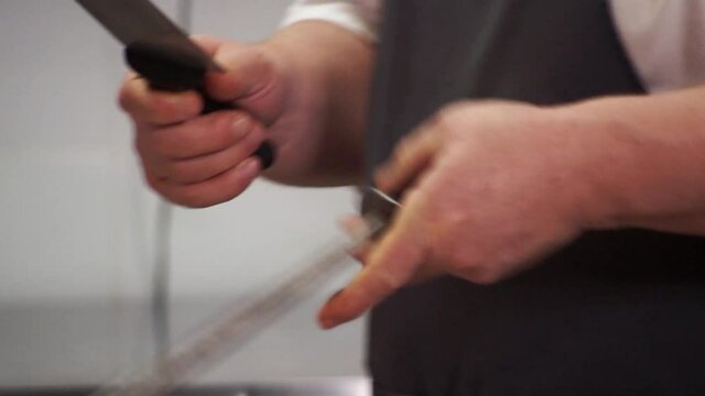 Cook in the kitchen sharpen the knife