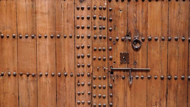 Moroccan, wooden entrance door. Traditional Moorish, Moroccan design and architecture.