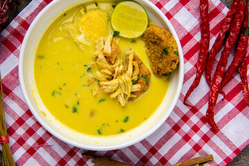 Nasi Soto Ayam or Soto Medan is  Traditional chicken soup with rice from Medan, North Sumatra. 

Soto is a traditional Indonesian soup mainly composed of broth, meat, fried patties and vegetables.